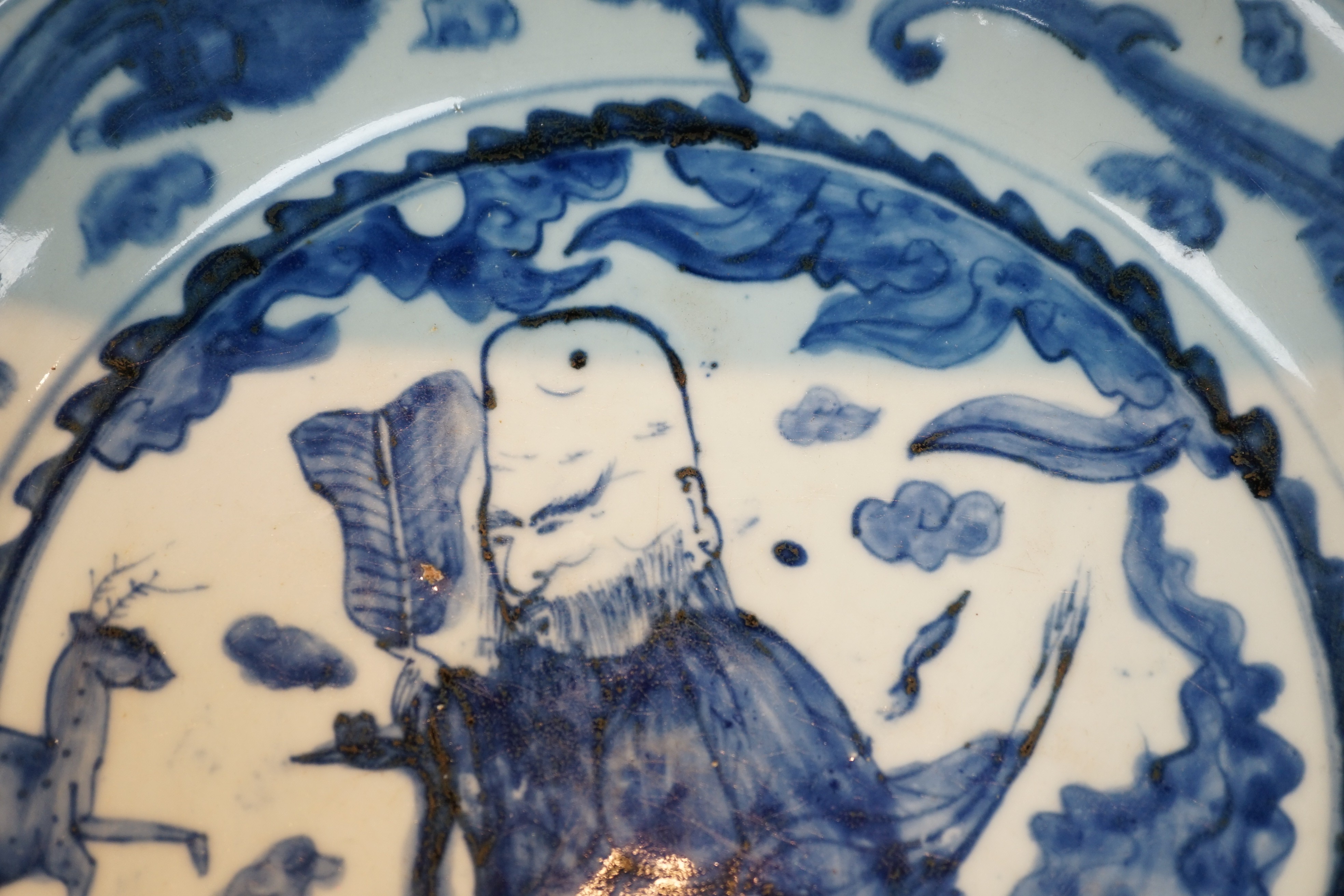 A large Chinese Swatow blue and white ‘Shou Lao’ dish, Zhangzhou kilns, Wanli period, 43.4cm diameter, tiny rim chip